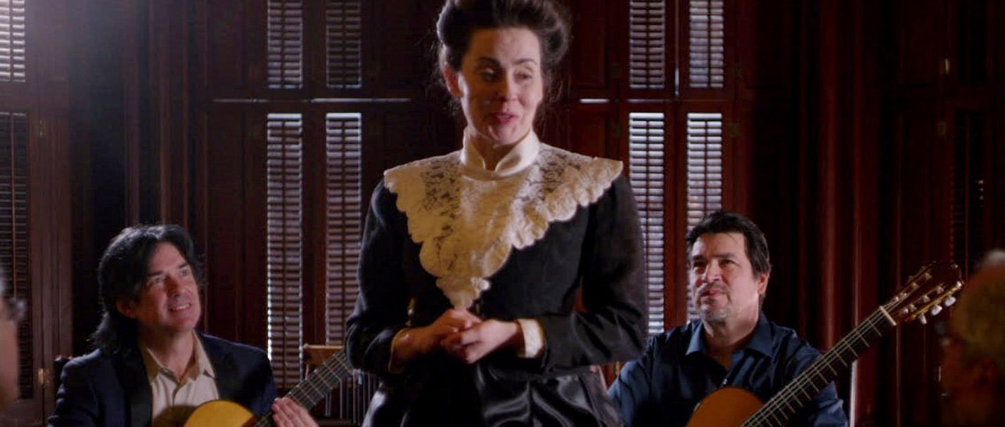 Actress portraying Mrs. Gresham, with musicians